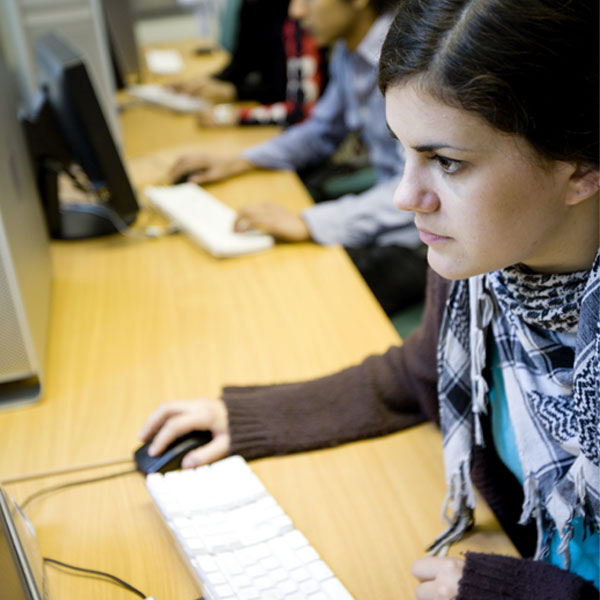 young woman looking at computer