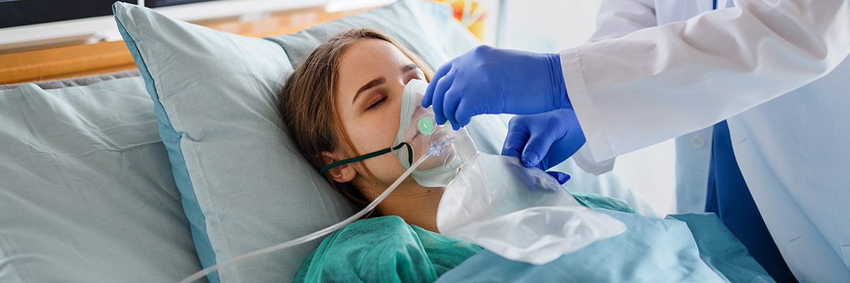 respiratory care professional assisting patient