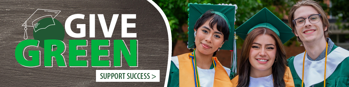 Graduates wearing caps and gowns, smiling together outdoors