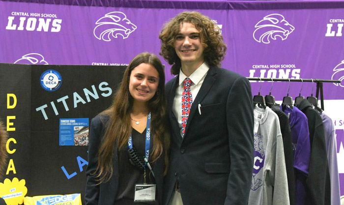 Kiara Simerly and James Webb, students at Columbia Central High School, attend the 8th grade career fair to present a table for DECA, a club preparing students for careers in marketing.
