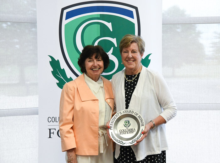 Dr. Janet F. Smith, Columbia State president, presents Vicki Crunk Cain with the President’s Award of Honor for Distinguished Alumni.