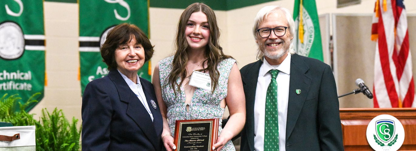 Annalesia Faith Matzirakis received the Carolyn Allred/Lewis Moore Outstanding Student award. Pictured with Dr. Janet F. Smith, president of Columbia State (left) and Dr. Barry Gidcomb, Columbia State professor of History (right).