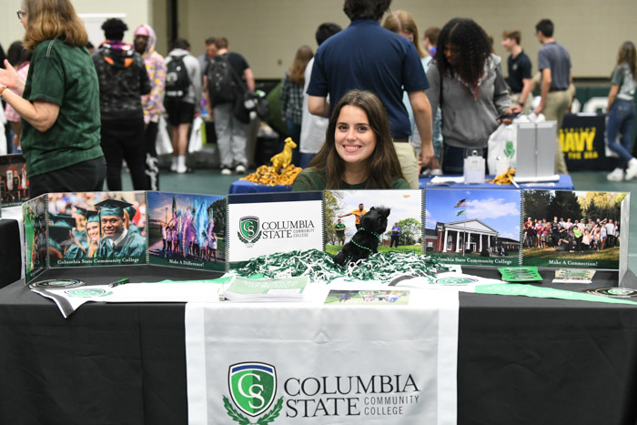 Columbia State student Kiara Simerly manning a table at the 2023 College Fair.