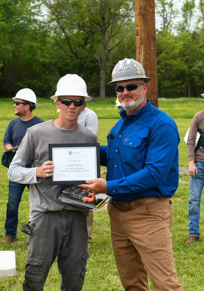 Caleb Carter receives the Pre-Apprentice Lineworker Academy Outstanding Student Award.