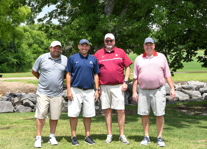Pictured (left to right): Second flight, first place winners Robert Oldham, Clarke Oldham, Will Collins and Mark Blackburn.