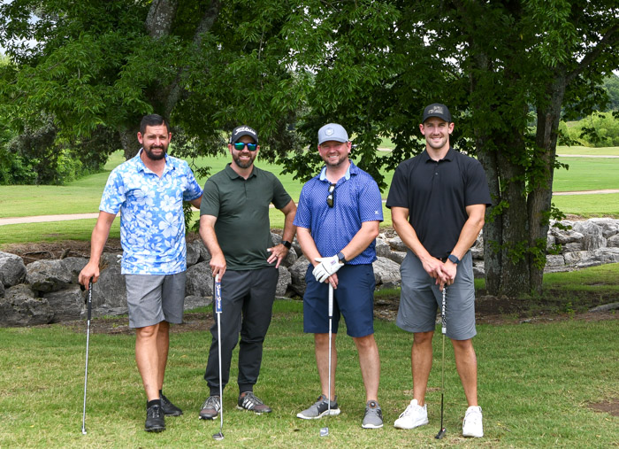 Pictured (left to right): First flight, first place winners Sheldon Ellsworth, Chris Miller, Jonathan Davidson and Justin Phelps.