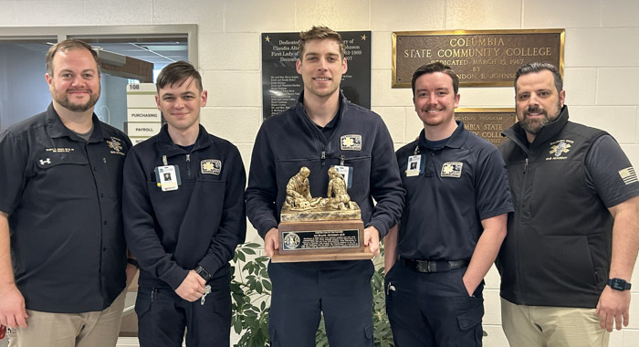 Columbia State paramedic students stand with an award.