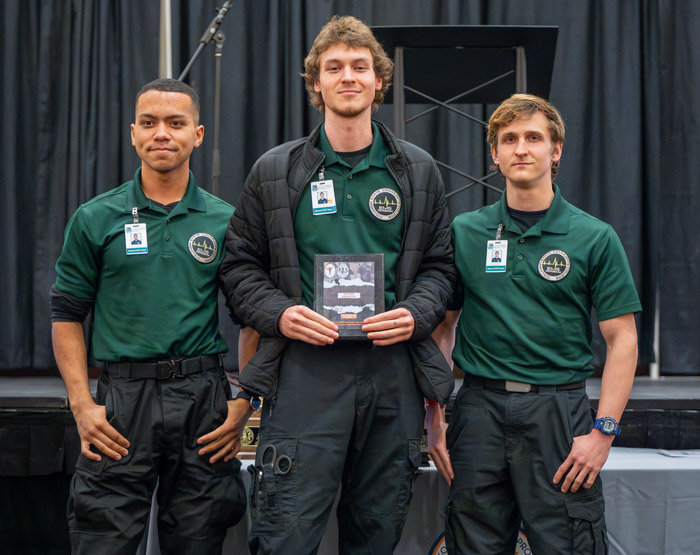 Columbia State Advanced Emergency Medical Technician students with the second place Student Basic Life Support division plaque