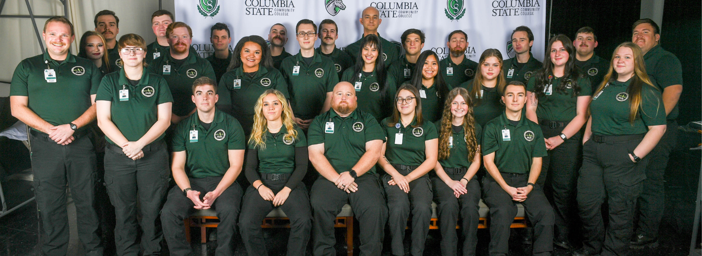 A group photo shows all 28 Columbia State Fall 2025 AAEMT graduates.