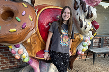 Student with highly decorated chair in the back