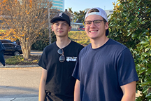 Two students smiling
